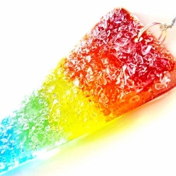 A Rainbow coloured g;ass sparky icicle ornament.