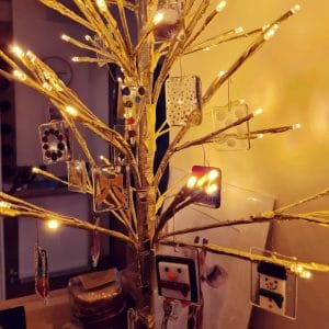 Advnt Calendar glass decorations on a gold twig tree